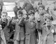 Spain: Republican children preparing to be evacuated in the aftermath of defeat by the Nationalists. Here they are giving the Republican / International salute as a sign of defiance